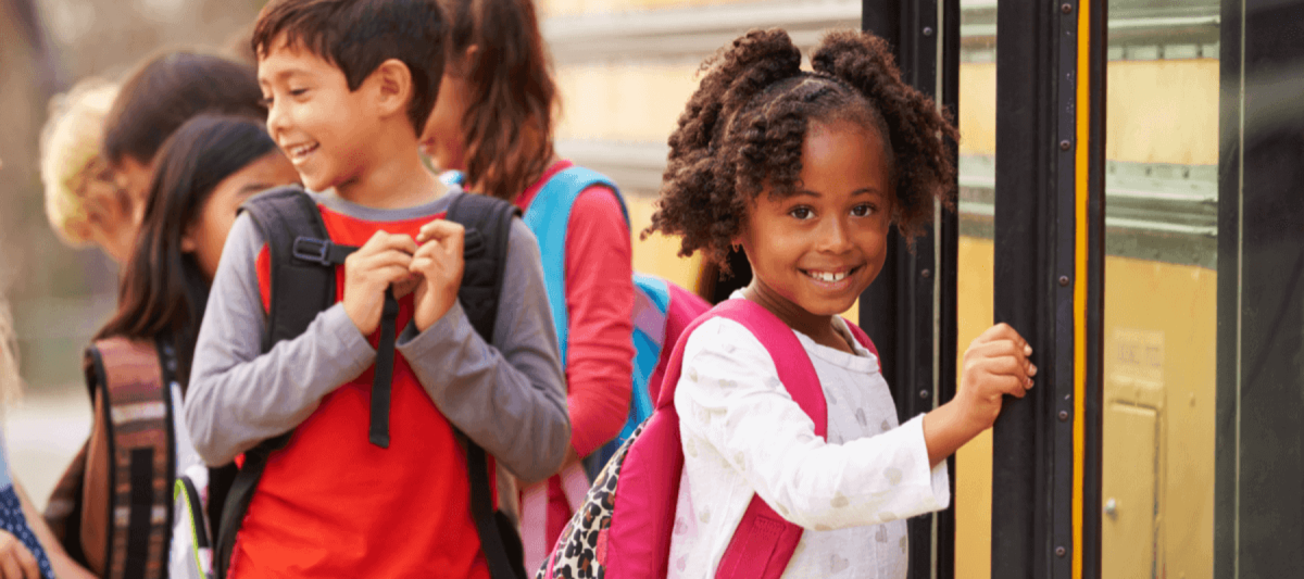 Kids getting on to school bus