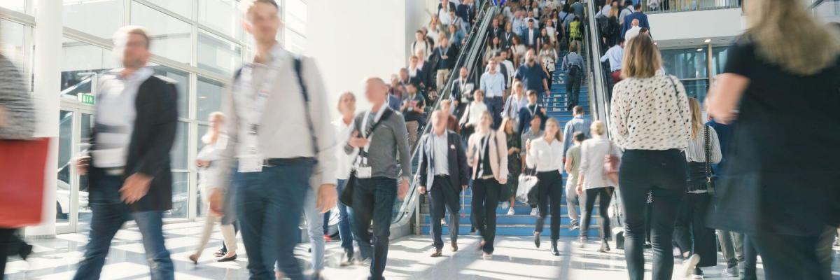 crowd of attendees entering a convention