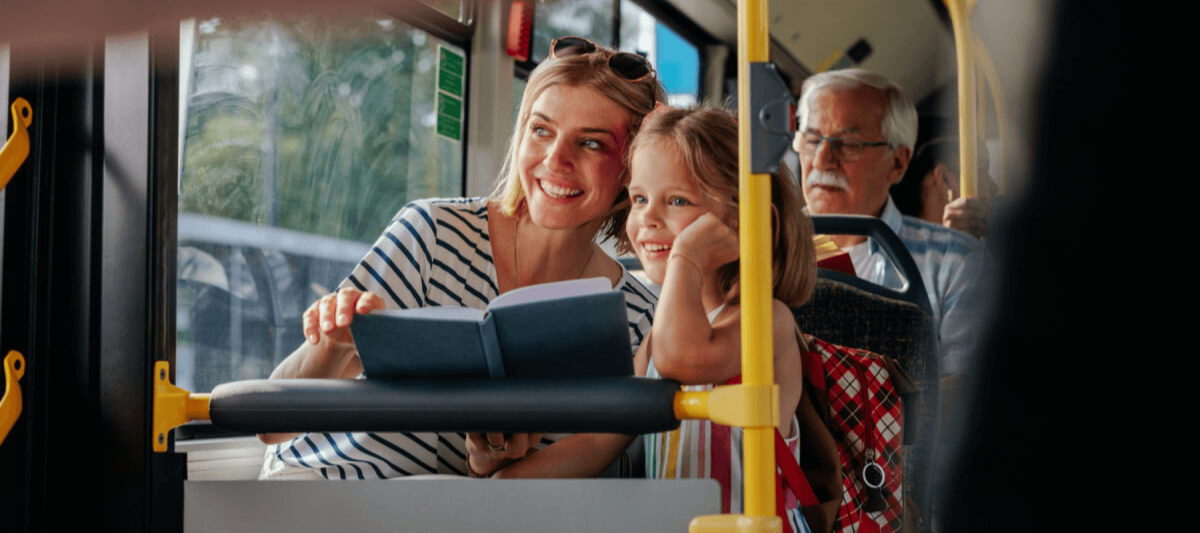 Mom and daughter traveling on charter bus